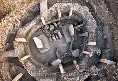 Aerial view of round enclosure with concentric stone walls.