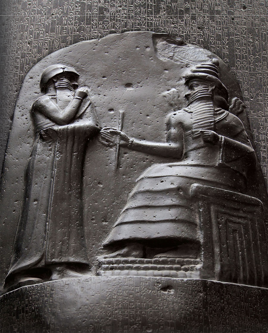 A depiction of a figure seated on a throne and holding a wand, recieving a standing figure before him.