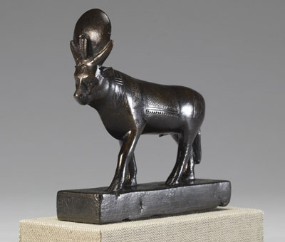 A bronze Apis Bull with a disk between its horns.
