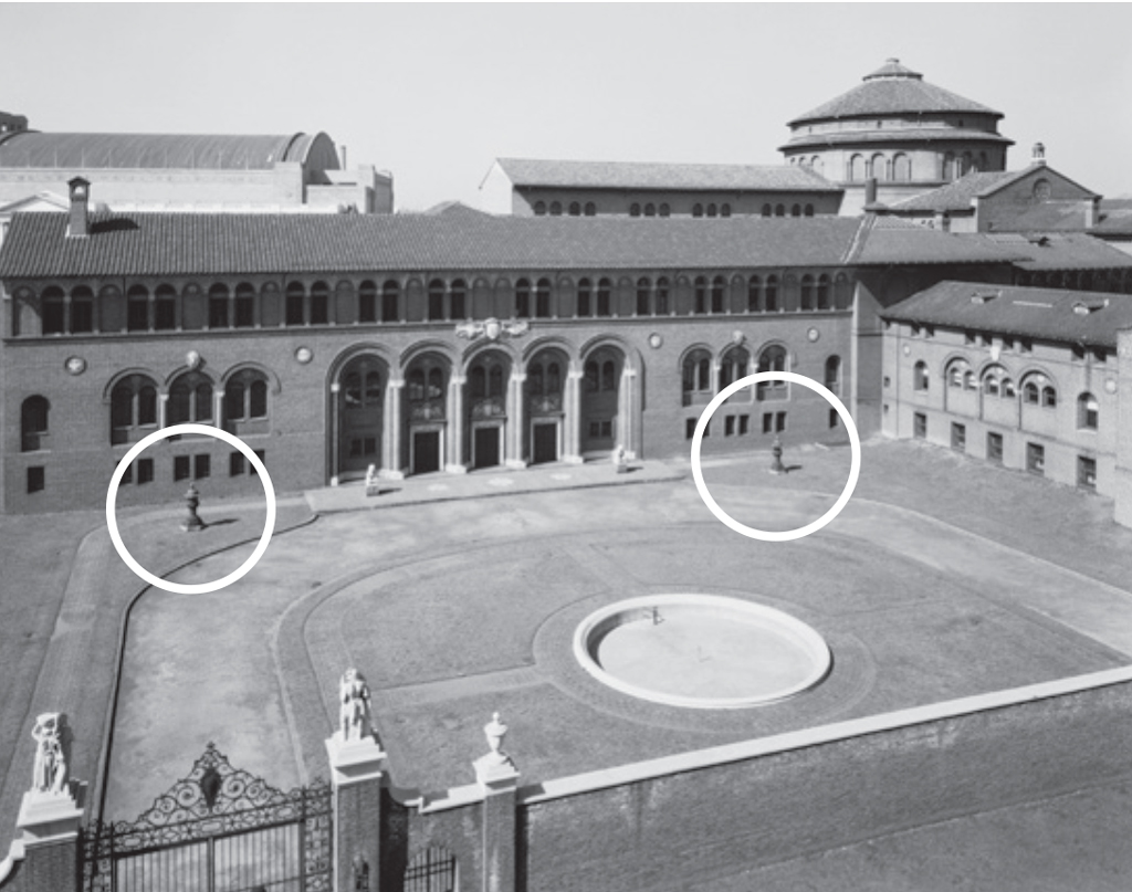 An old photo of the Penn Museum's Stoner Courtyard entrance with the two lanterns circled in white