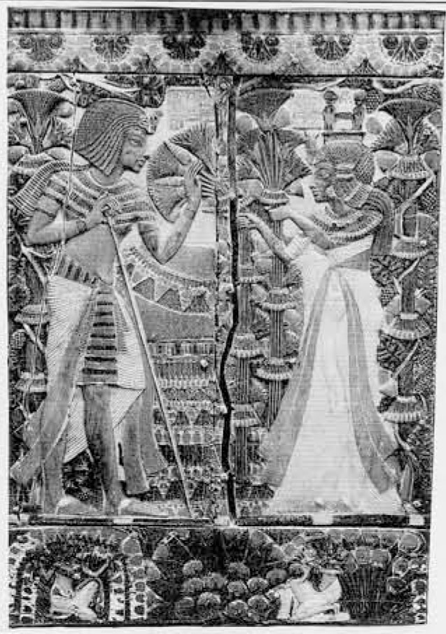 A depiction of the pharaoh and his wife, facing each other, carved into a wooden lid.