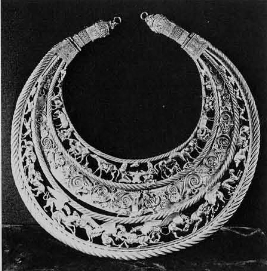Large, gold necklace made of three reigstters of animal figures.