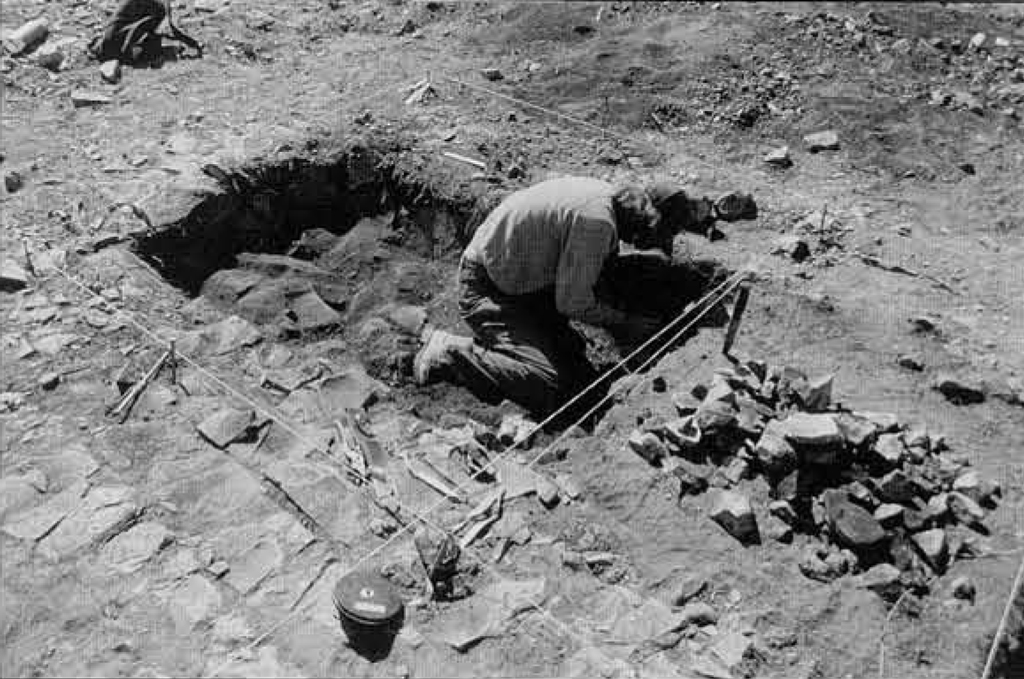 A person excavating a kiln area.