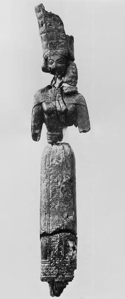 Small wooden statuette of Hera in a tall crown, arms broken off a the elbows.