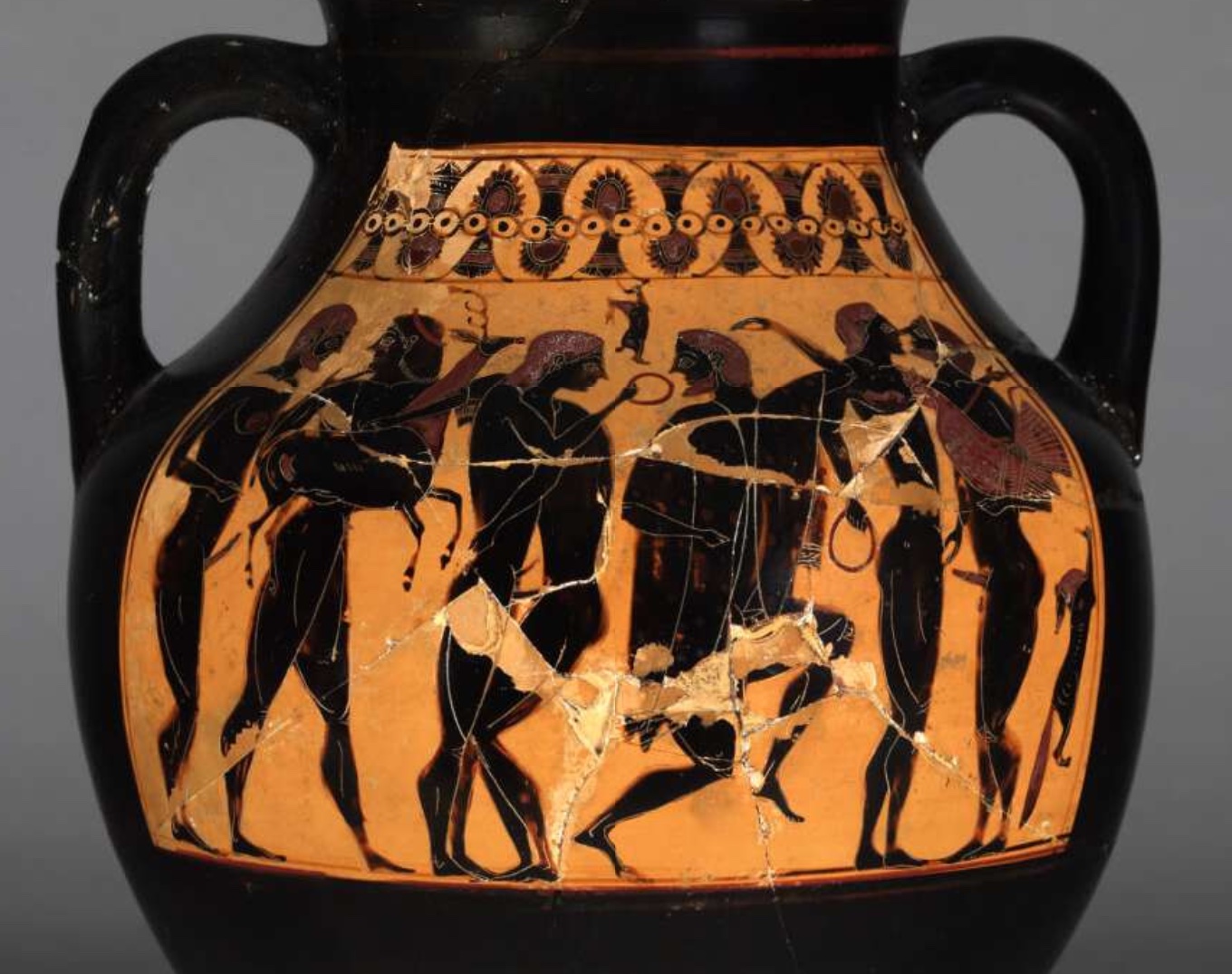 Attic black-figured amphora showing a bearded older man has presented a young man with a stag, caught in the hunt. On the right, another holds a cockerel, also a love gift.