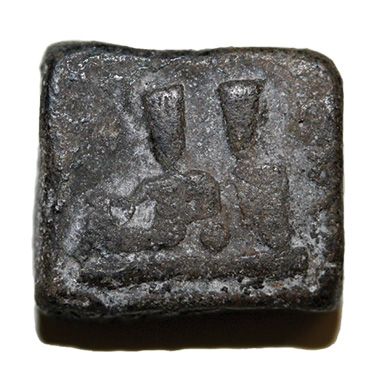 An engraved square token.