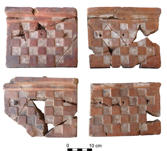 Four checkerboard patterned objects, broken and pieced back together.
