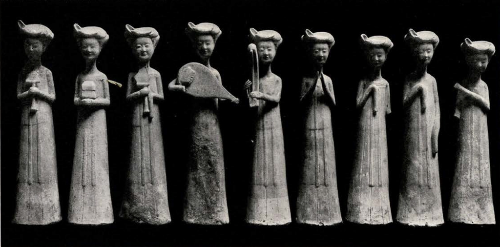 Nine figurines of standing women holding instruments or posing