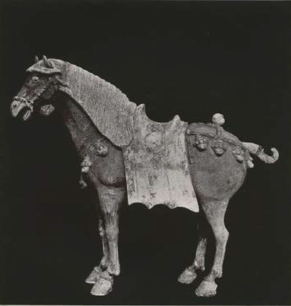 Painted ceramic standing horse figure with saddle painted to look like brocade