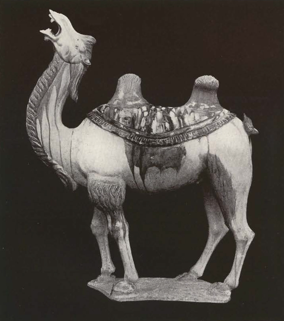 Glazed clay figure of two humped standing camel with neck up and mouth open, no pack in-between the humps