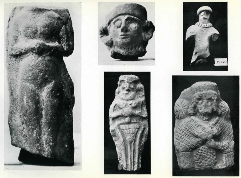 Five figurines of humans, on head, one body missing head nad feet, one missing arms and legs, one full, one missing below the hips