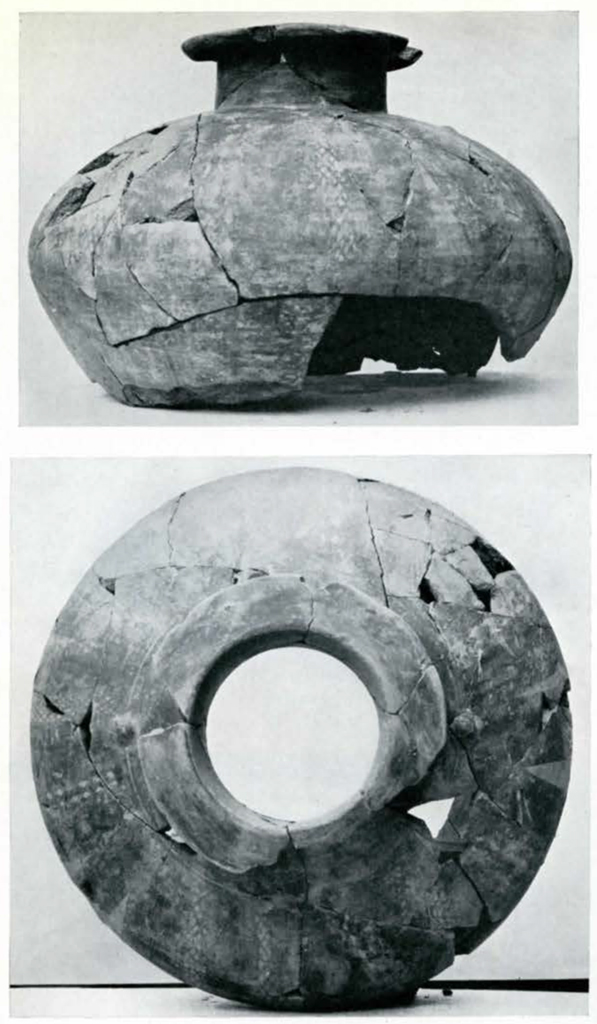 Top and side views of a jar, fragmented and pieced back together, bottom missing
