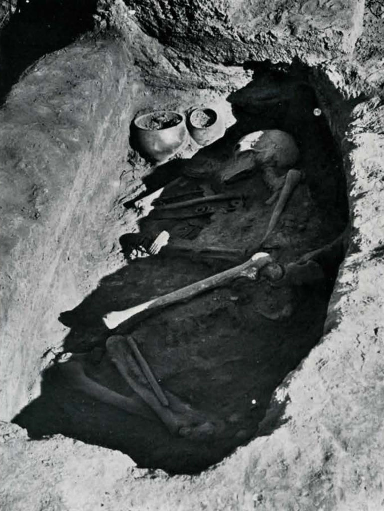 Burial remains with two cups or jars, in situ