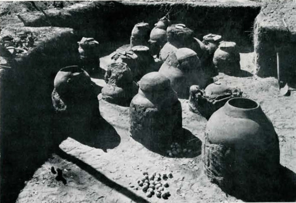 Several pots in a shallow pit