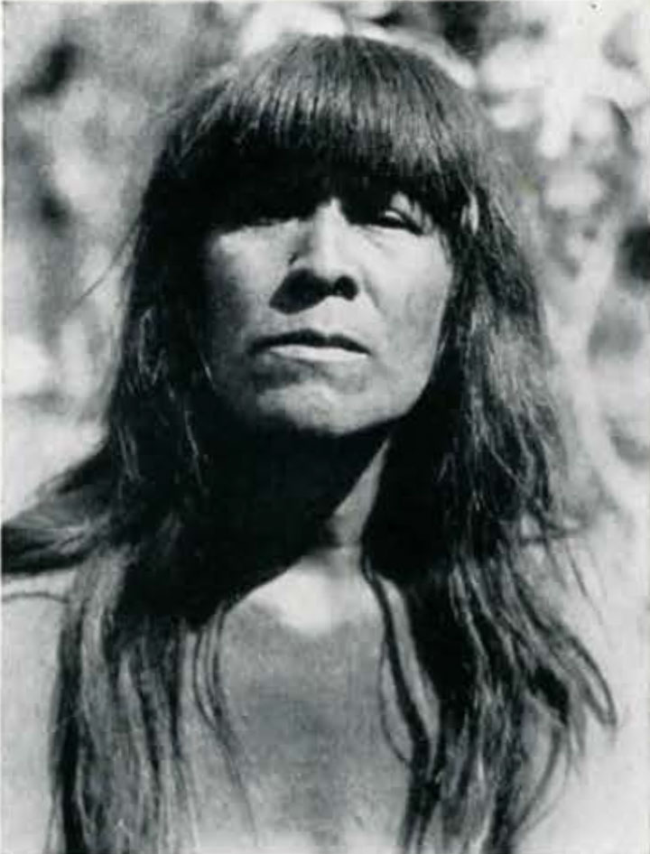 Portrait of a woman with long hair and bangs