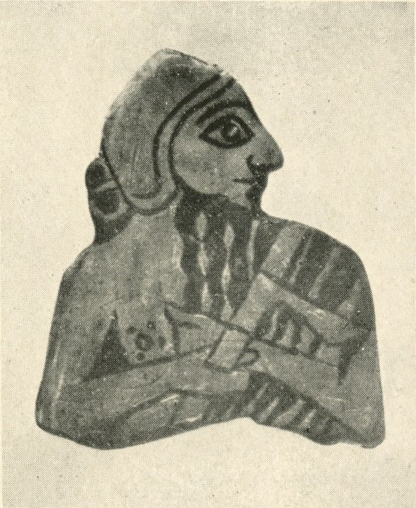 Fragment of inlay showing a bearded man, torso up, holding an axe