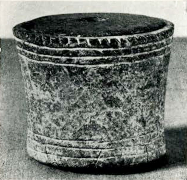 Taller cylindrical pyxis with horizontal bands around the top and bottom