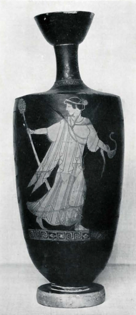 A vase with tall neck showing a Maenad walking and holding a staff and a snake