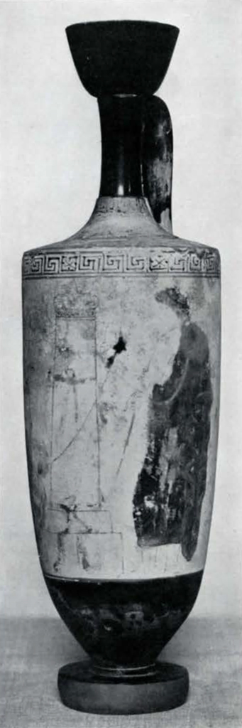 A vase with handle and long neck, showing a graded image of a man in front of a stele