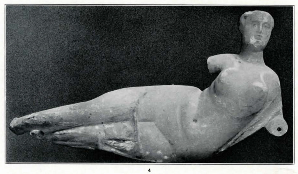 Statue of a reclining woman, feet and arms missing