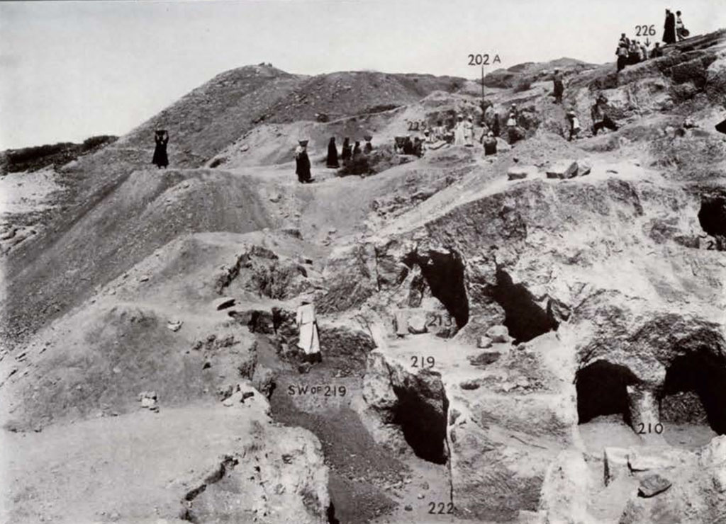 Mid excavation view of cemetery with numbered tombs
