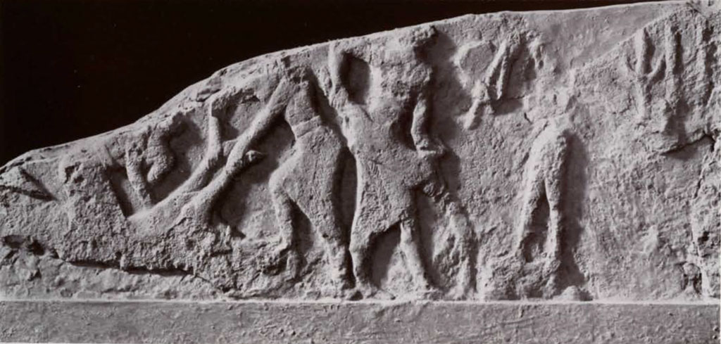 Stela fragment showing a bull being sacrificed