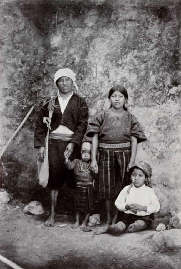 A family photograph of a mother, father, and two children