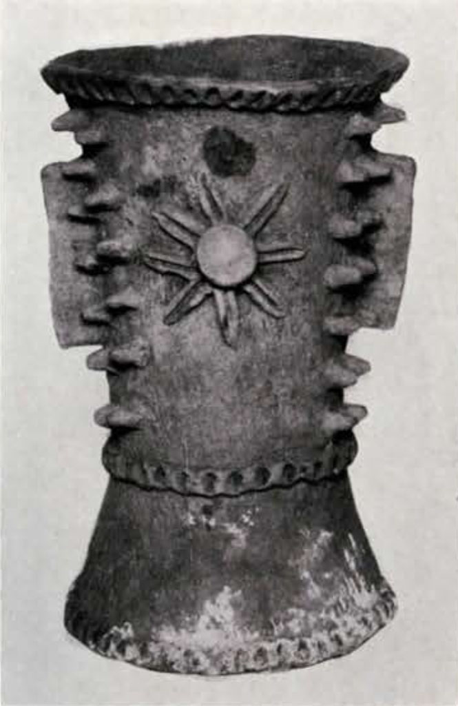 An urn or censer with a sun design