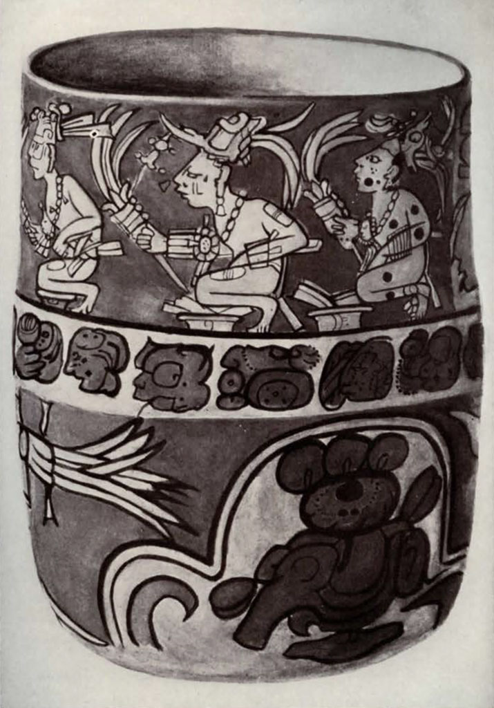 A cup with two registers of designs, top featuring crouching figures